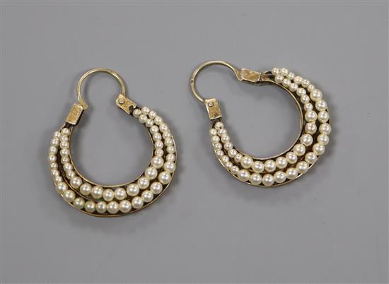 A pair of Georgian yellow metal and seed pearl set double crescent earrings, width 23mm.